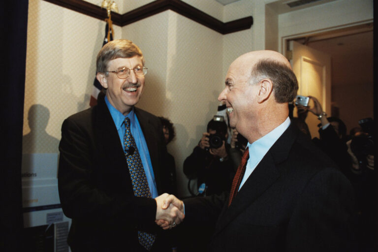 Francis Collins (NHGRI) and Craig Venter (Celera Genomics) at a press conference for the publications describing the initial analyses of the human genome sequence.