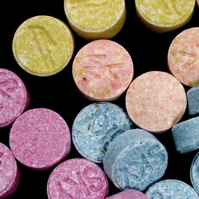 Ecstasy pills in yellow, magenta, pink, blue and green — pharma coverage from STAT