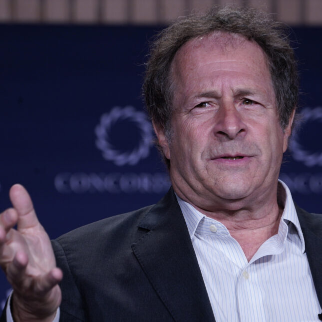 President Multidisciplinary Association for Psychedelic Studies (MAPS) Rick Doblin gestures with his right hand while speaking at the Concordia Annual Summit — coverage from STAT