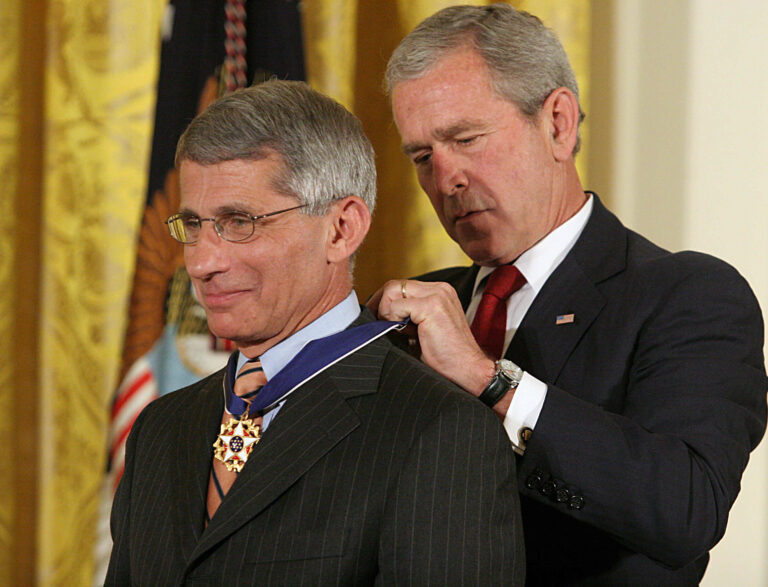 US President George W. Bush presents the Presidential Medal of Freedom on June 19, 2008 to Anthony Fauci, director of the National Institute of Allergy and Infections Diseases, in Bethesda, Maryland during ceremonies at the White House in Washington, DC. The Presidential Medal of Freedom, the nation's highest civilian award, recognizes exceptional meritorious service. AFP PHOTO/Karen BLEIER (Photo credit should read KAREN BLEIER/AFP via Getty Images)