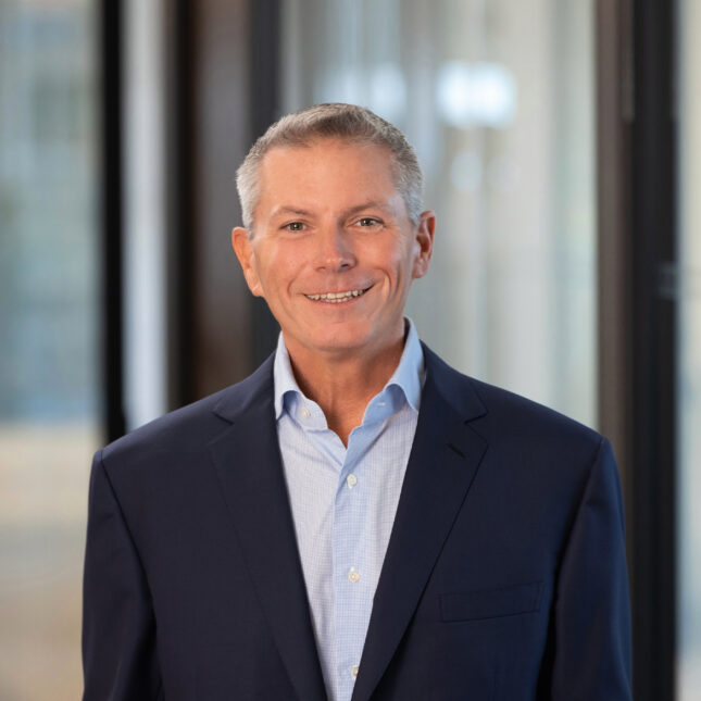 Portrait of a man wearing a blue blue blazer and blue button down collar shirt. -- coverage from STAT