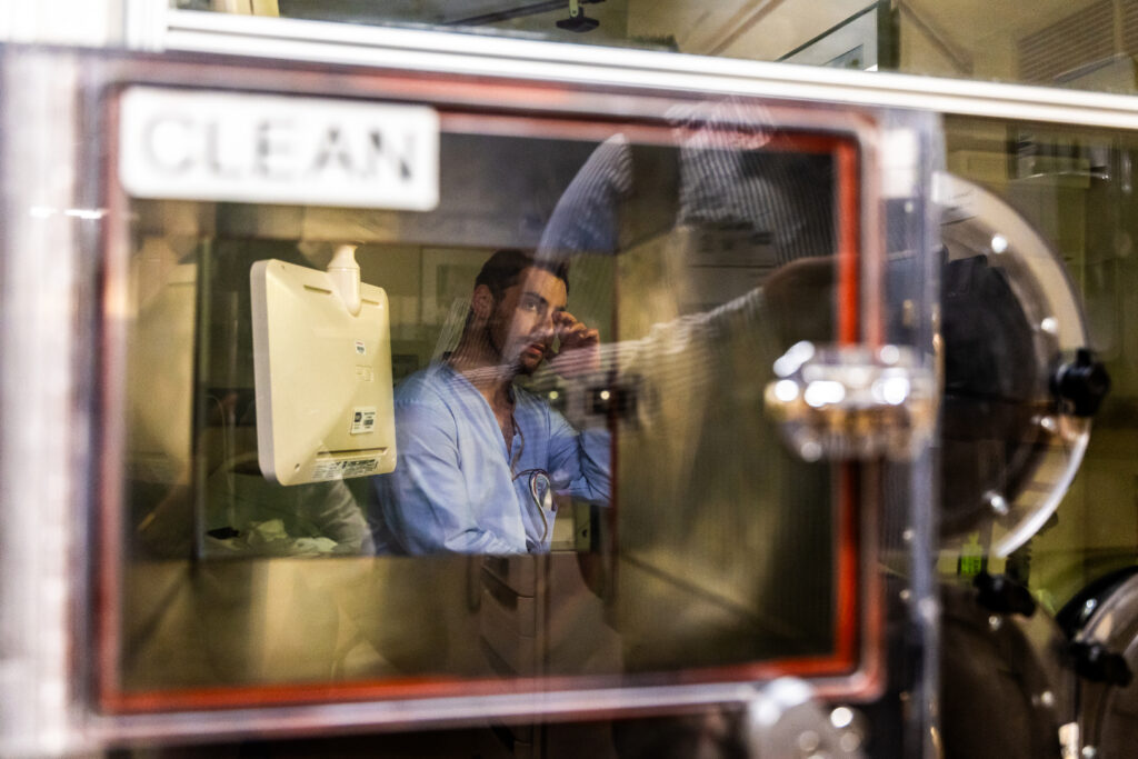 Joel Landy, 28, a participant in a National Institutes of Health study on the effects of ultra-processed diets, wakes up in a metabolic chamber on Aug. 14, 2024, in Bethesda, Maryland. Participants stay at the NIH for four weeks, each receiving a different diet every week with three meals a day. Once a week, participants also spend 24 hours inside the 27-cubic-meter metabolic chamber, where their energy expenditure is measured overnight.